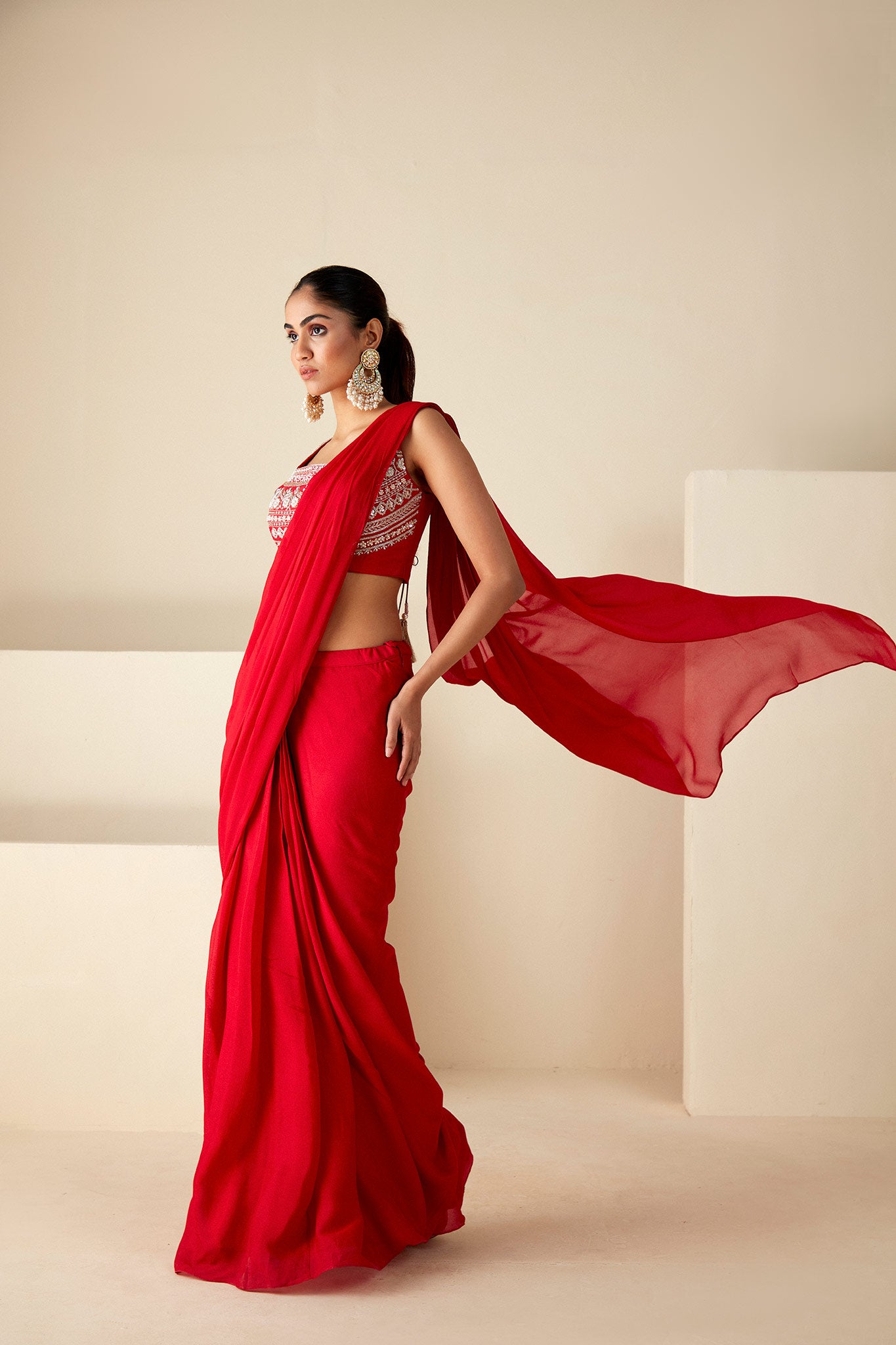 Red pre-draped Saree