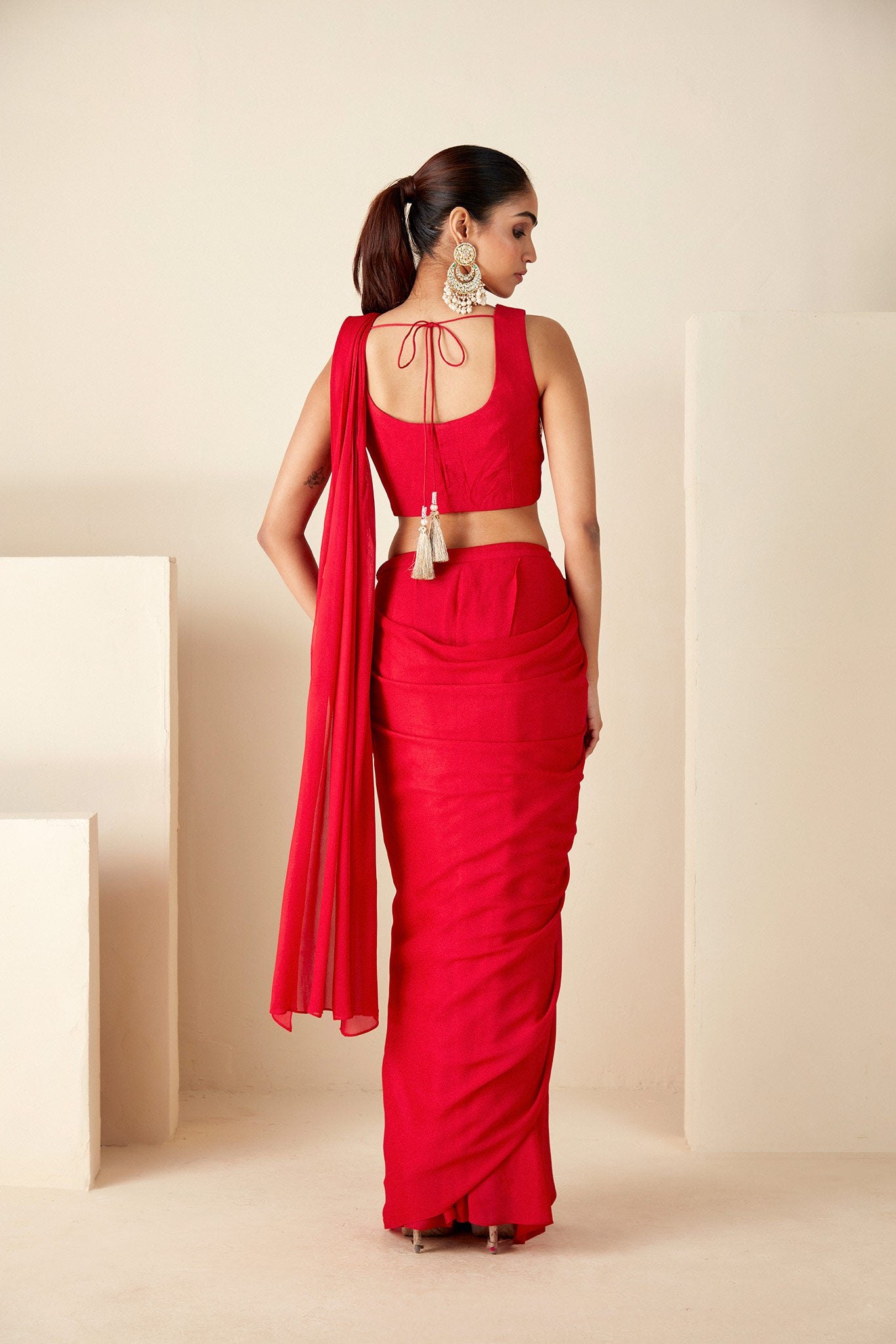 Red pre-draped Saree