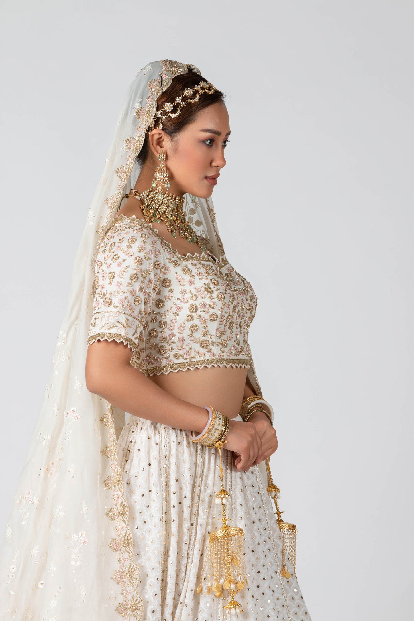 Off-white hand embroidered bridal lehenga set